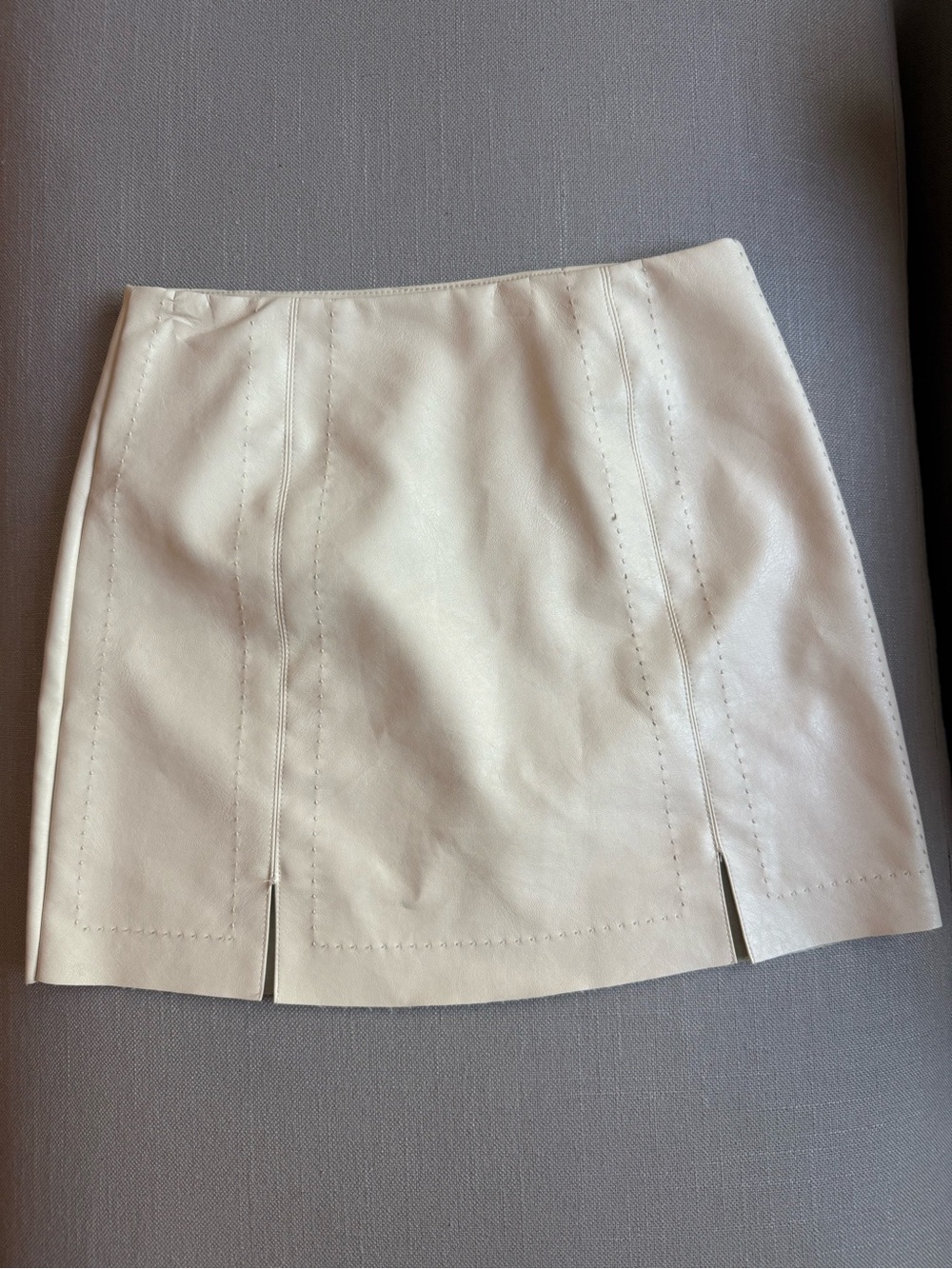 Francesca’s Faux leather cream miniskirt with front slits